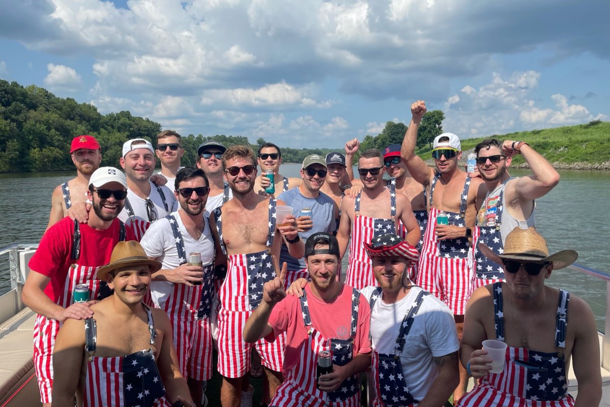 group of men wearing american flag clothing on a river cruise