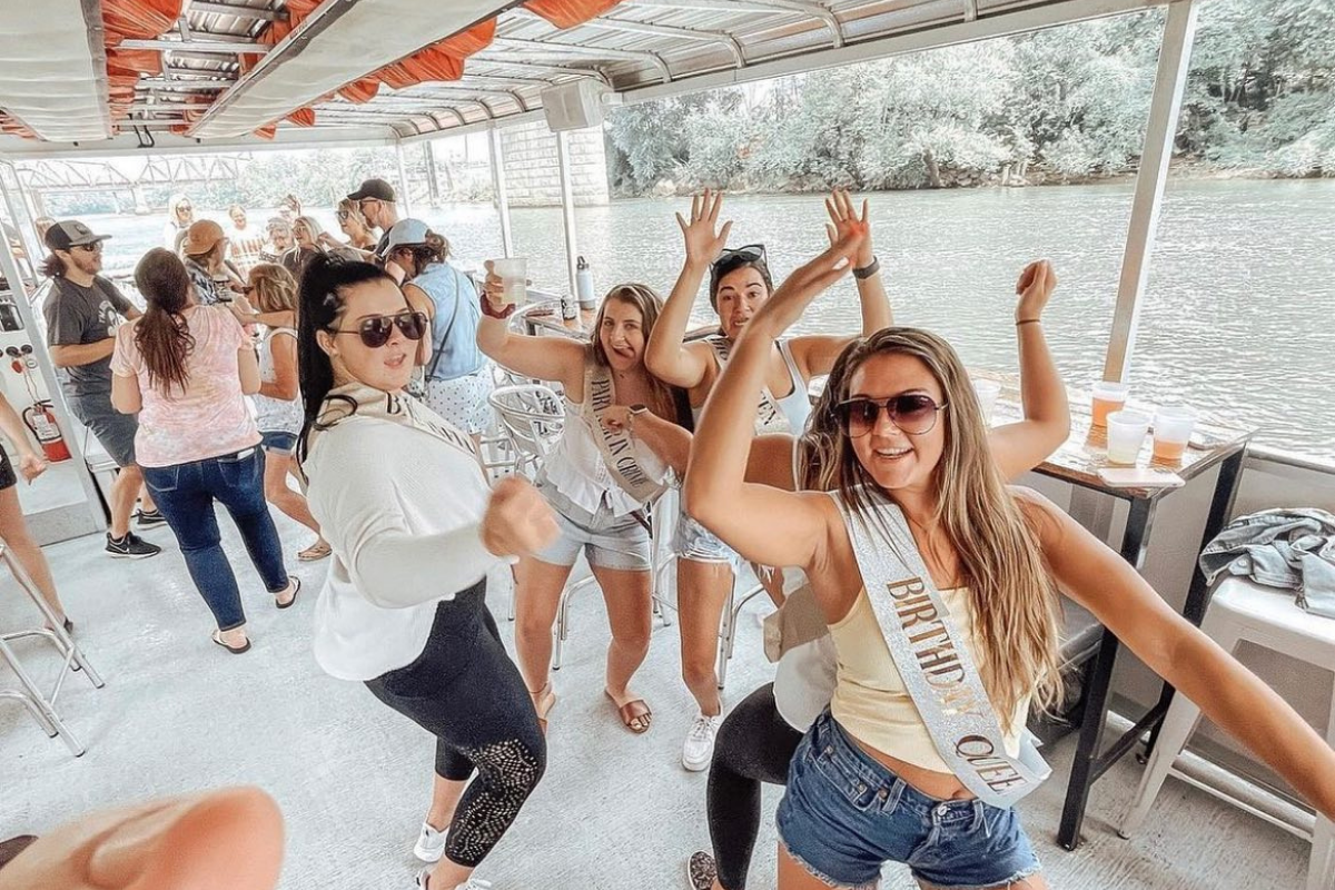 women dancing on birthday party boat cruise