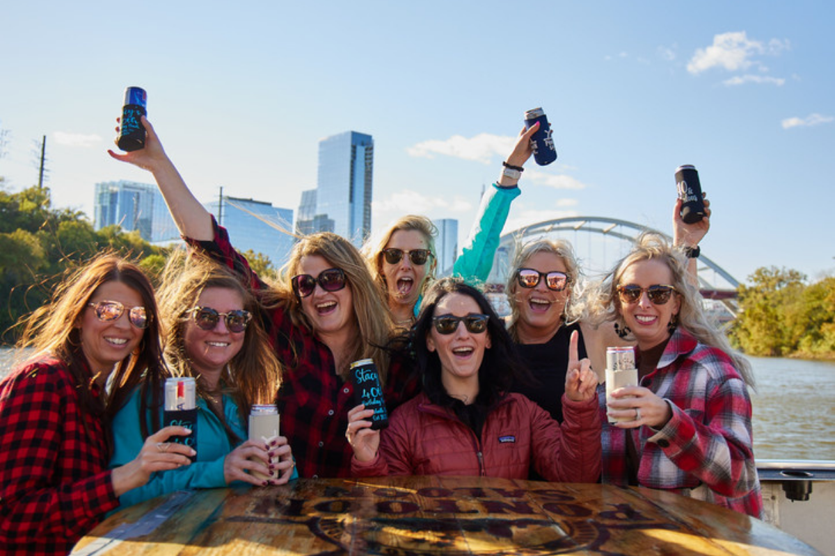 group of female friends smiling on a private boat party