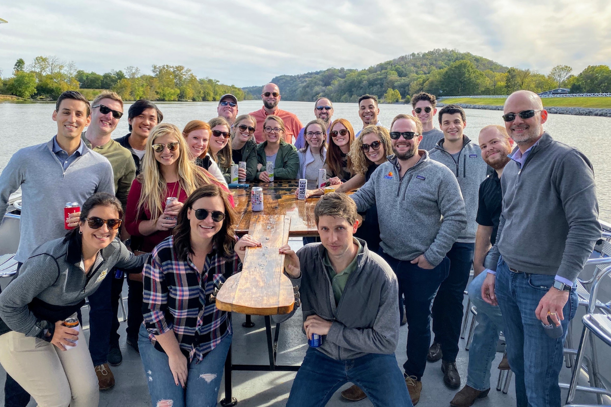 coworkers at team building event on the pontoon saloon