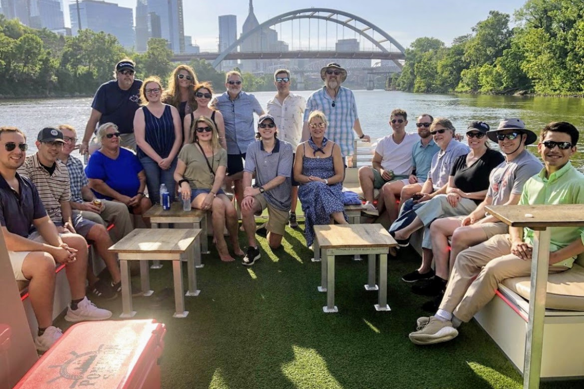 group of coworkers at a team building event on the river