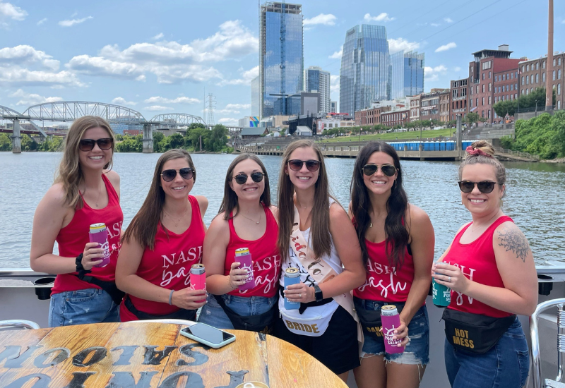 small group bachelorette party in matching red shirts