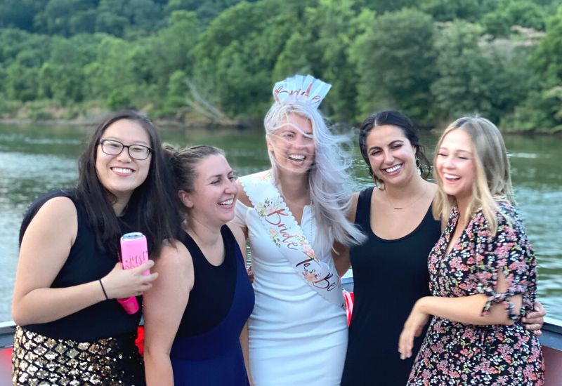 bride and friends at pontoon bachelorette party