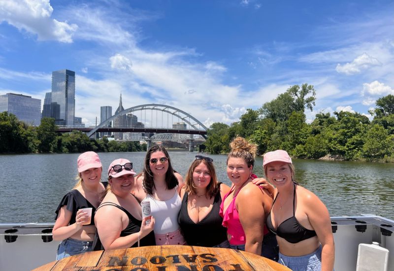 group of 6 friends on a sunny river cruise