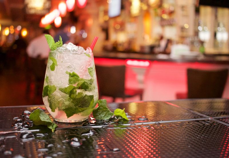 mint cocktail sitting on a bar