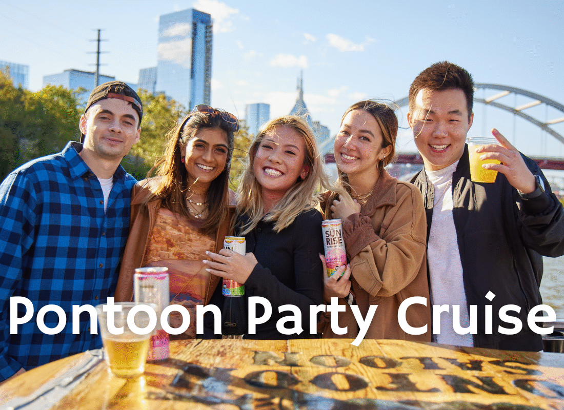 group of women holding cans in koozies while smiling on a bachelorette party in nashville
