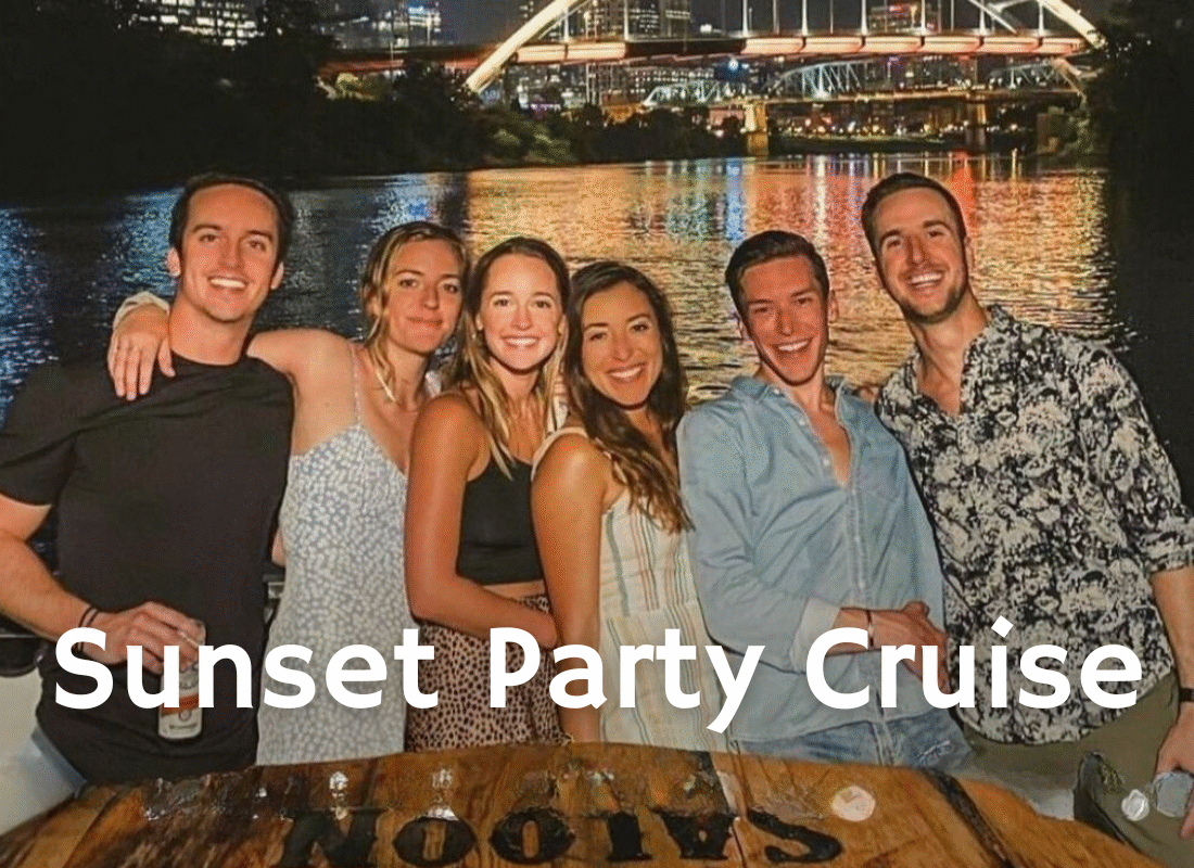 group of friends smiling on an evening river cruise for a bachelorette party in nashville