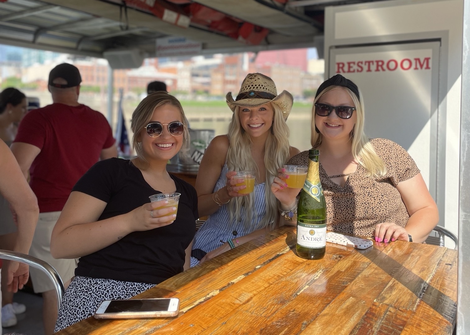 Group with koozies on Nashville pontoon party cruise